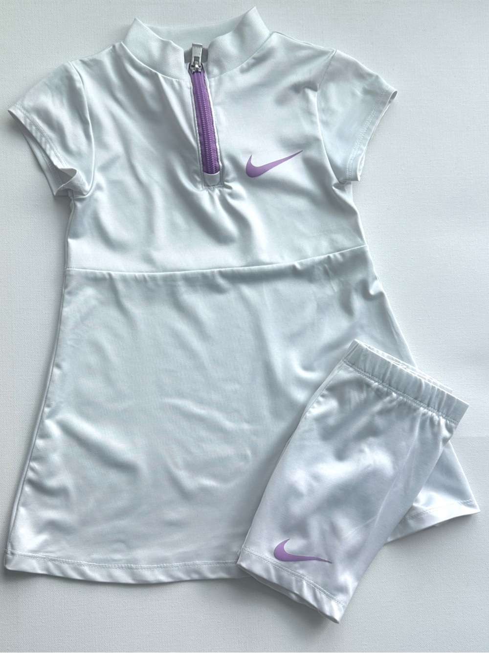 Nike girl’s set White Kids Athletic Shorts with lavender Swoosh logos.  Size 4T.